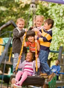 Kids with Hip Dysplasia swinging on a tree swing