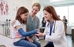 Dr. Wiesman examining a young girl